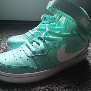 Nike Green and White Sneakers with Classic Design